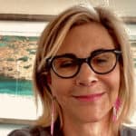 Portrait photo of Dr. Pamela Sobo, Psy.D. smiling in front of a painting. Portrait photo of Dr. Pamela Sobo, Psy.D. smiling in front of a painting.